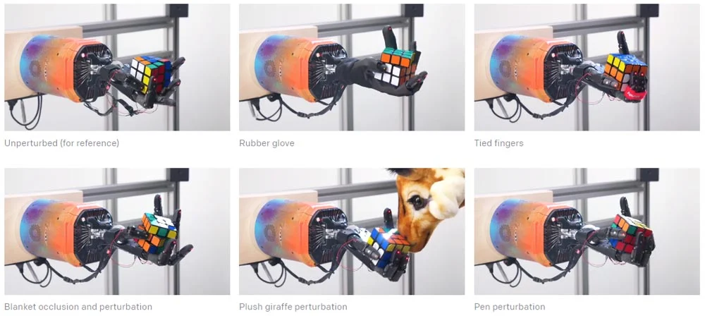 Die automatisierte Randomisierung der Trainingsumgebung hat die Roboterhand-KI Dactyl robust gemacht gegen Störungen. Selbst der hinterhältige Angriff einer Plüschgiraffe (Mitte unten) kann ihr nichs anhaben. Bild: OpenAI
